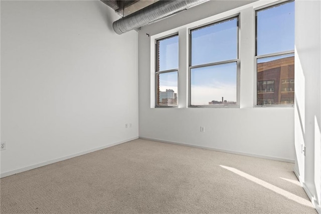 unfurnished room with carpet flooring