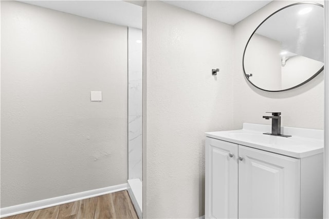 bathroom with vanity and hardwood / wood-style flooring