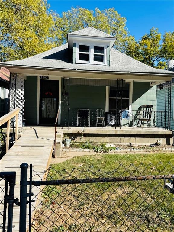 back of house featuring a porch