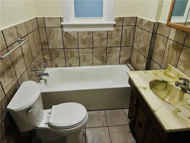 bathroom with a tub to relax in, vanity, toilet, and tile walls