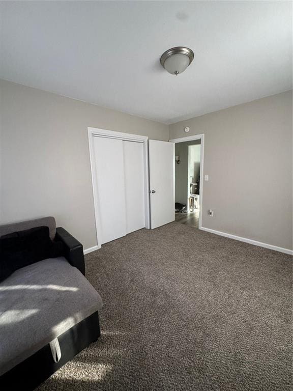 carpeted bedroom featuring a closet