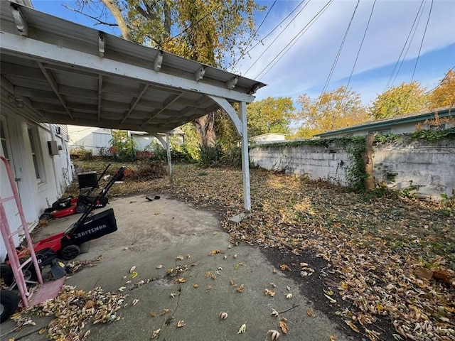 exterior space with a carport