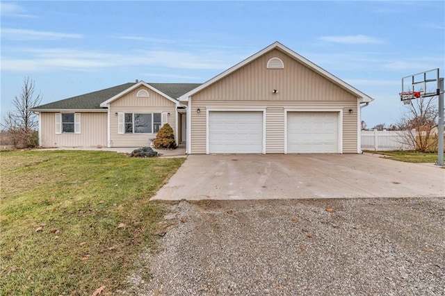 ranch-style house with a garage and a front yard