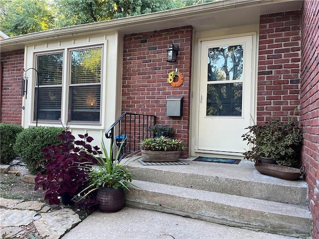 320 Jones Ave, Warrensburg, MO 64093 - doorway to property featuring brick siding