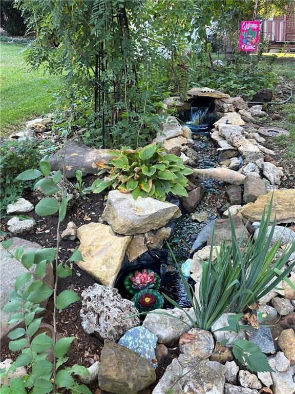 320 Jones Ave, Warrensburg, MO 64093 - exterior view of a small pond