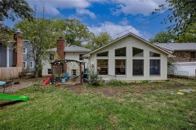 320 Jones Ave, Warrensburg, MO 64093 - rear view of property featuring a patio area and board and batten siding