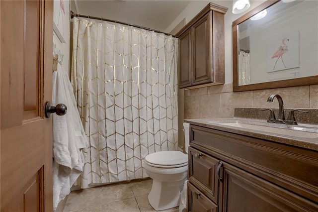 bathroom featuring tasteful backsplash, toilet, vanity, curtained shower, and tile patterned flooring