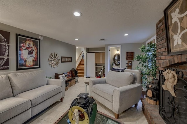 living room with a textured ceiling, light tile patterned floors, and a fireplace