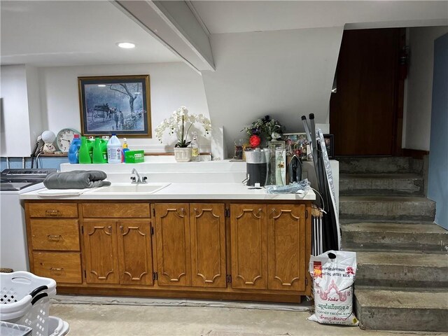 320 Jones Ave, Warrensburg, MO 64093 - bar area with a sink, concrete floors, washer / clothes dryer, and stairs