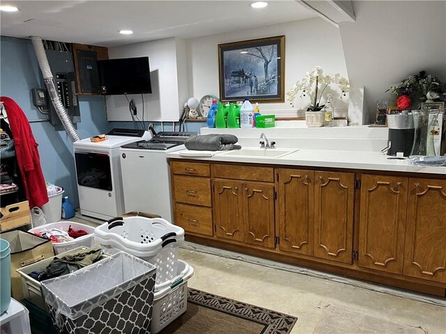 320 Jones Ave, Warrensburg, MO 64093 - kitchen featuring independent washer and dryer, a sink, concrete floors, recessed lighting, and light countertops