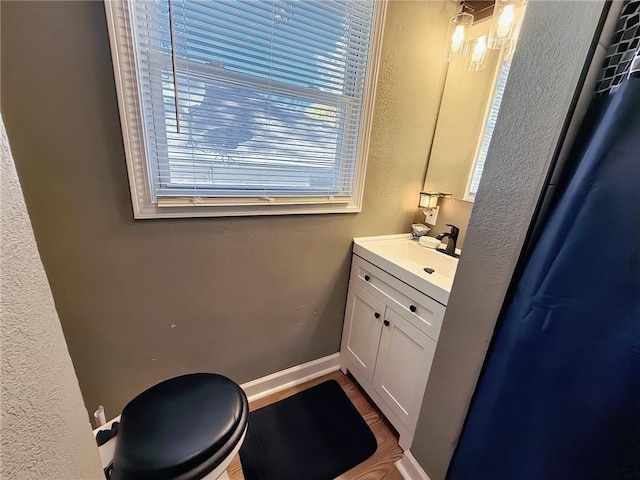 bathroom with vanity and toilet