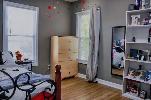 bedroom featuring hardwood / wood-style flooring