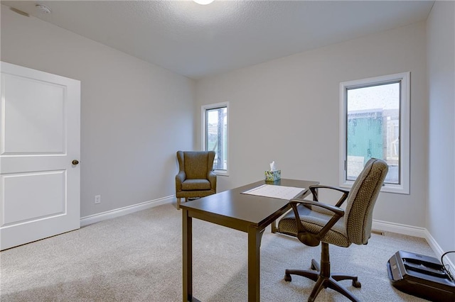 office space with light colored carpet and baseboards