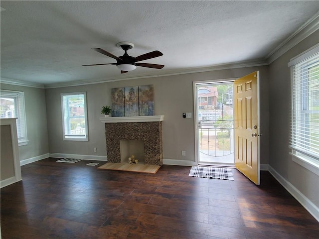 unfurnished living room with a fireplace, dark hardwood / wood-style floors, and plenty of natural light