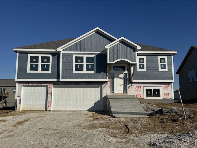 bi-level home featuring a garage