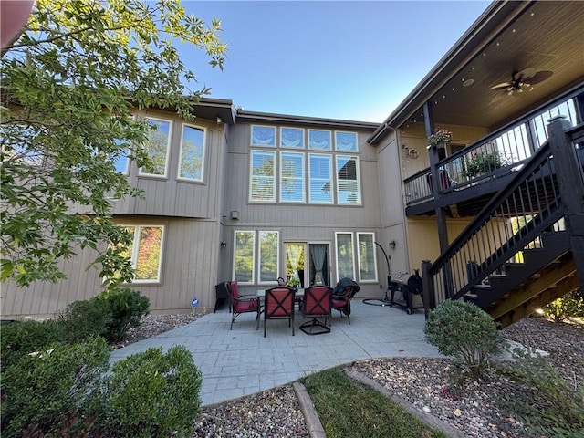 back of property with an outdoor hangout area, ceiling fan, and a patio area