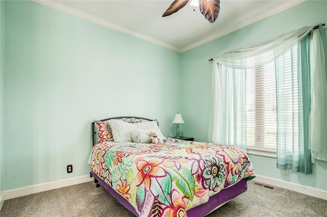 carpeted bedroom featuring multiple windows, ornamental molding, and ceiling fan