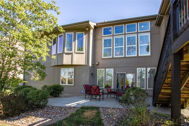 rear view of property featuring a patio area