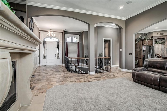 living room featuring baseboards, a chandelier, crown molding, and recessed lighting