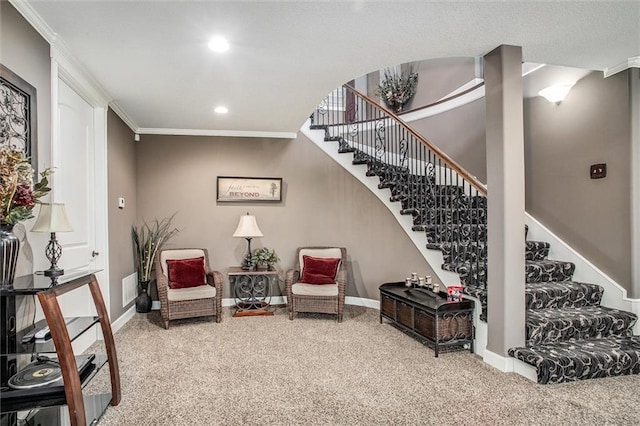 sitting room featuring baseboards, stairway, carpet flooring, and crown molding