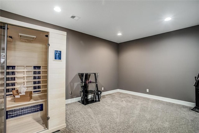 exercise area featuring a sauna, carpet, recessed lighting, and baseboards