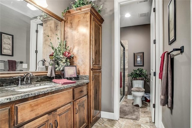 full bath featuring visible vents, baseboards, toilet, vanity, and a shower stall