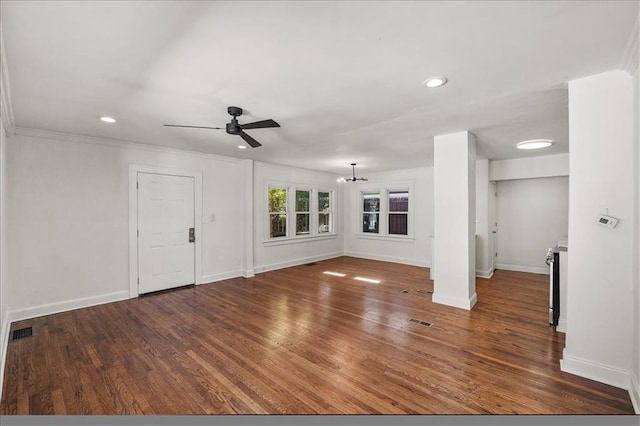 unfurnished living room featuring ornamental molding, dark hardwood / wood-style floors, and ceiling fan with notable chandelier