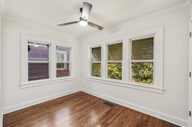 unfurnished room with ceiling fan, hardwood / wood-style flooring, and ornamental molding