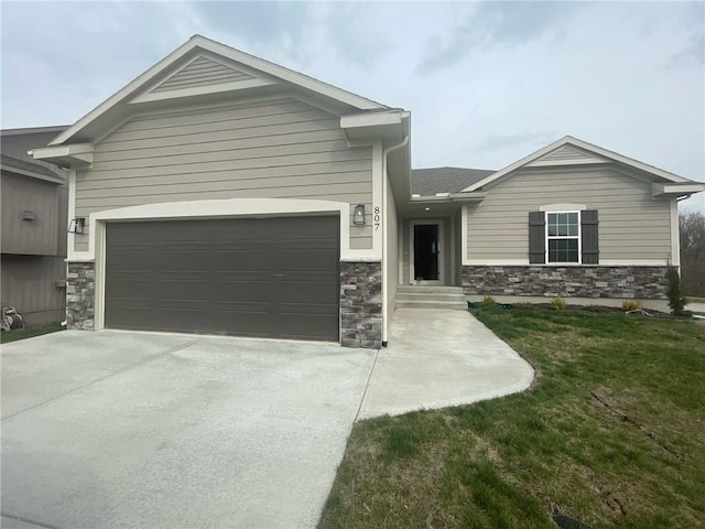 view of front facade with a front yard and a garage