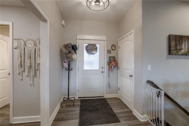 entrance foyer featuring dark hardwood / wood-style flooring