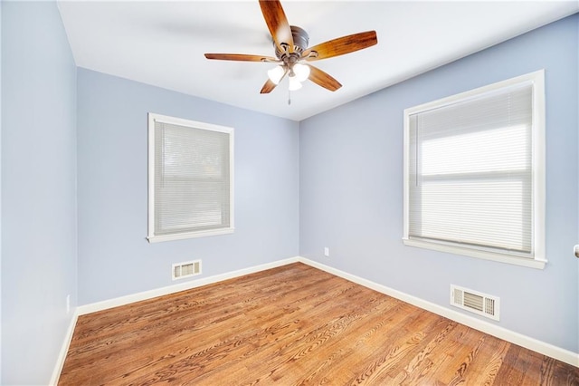 empty room featuring ceiling fan and light hardwood / wood-style flooring