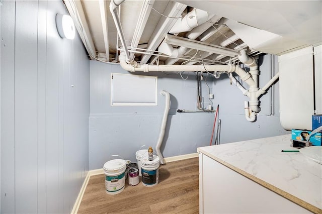 laundry area featuring hardwood / wood-style flooring