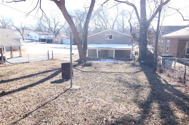 back of house featuring a porch