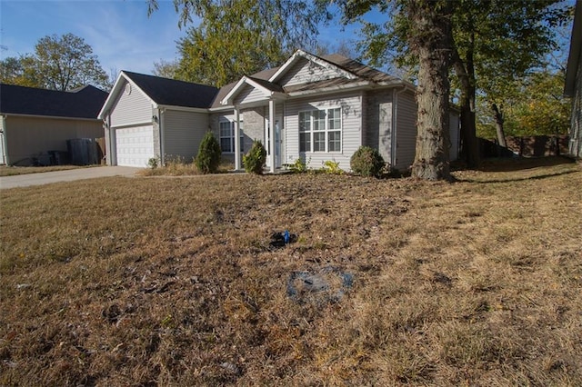 view of front of house with a front lawn and a garage