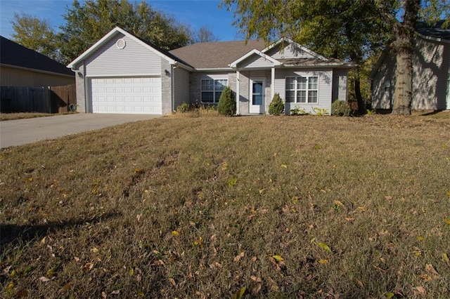 ranch-style home featuring a front yard and a garage