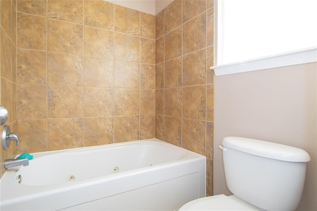 bathroom with toilet and a tub to relax in