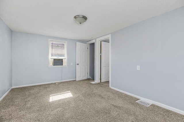 446 Montgall Ave, Kansas City, MO 64124 - spare room featuring carpet and baseboards