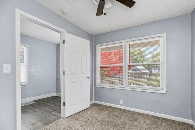 446 Montgall Ave, Kansas City, MO 64124 - carpeted spare room featuring a ceiling fan and baseboards