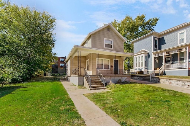 446 Montgall Ave, Kansas City, MO 64124 - view of front facade featuring a porch and a front yard