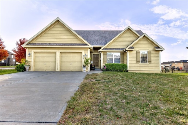 view of front of home with a garage and a front lawn