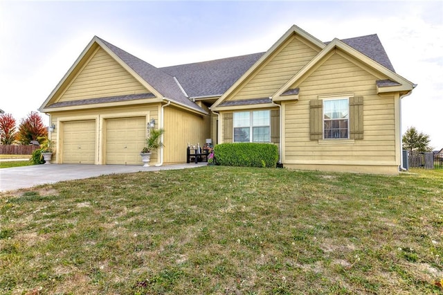 view of front facade featuring a front lawn and a garage