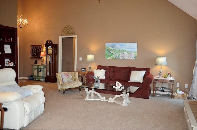 carpeted living room with high vaulted ceiling and an inviting chandelier