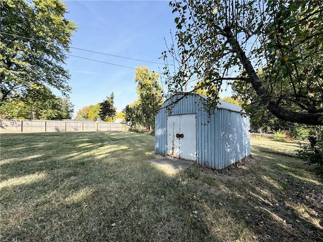 view of outbuilding with a yard