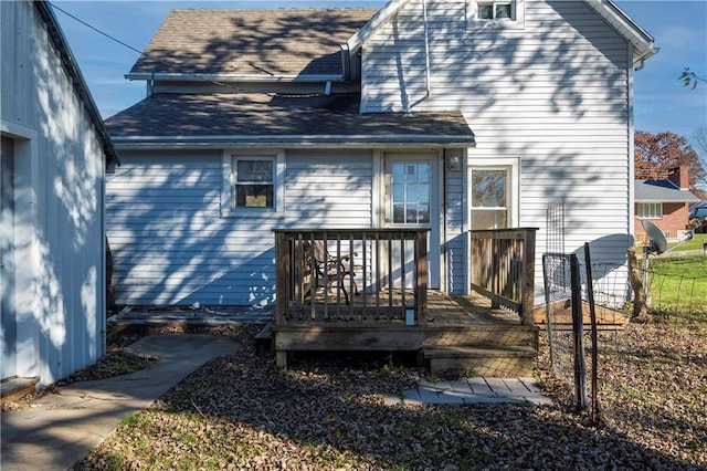 605 N Ardinger St, Hamilton, MO 64644 - back of house with a deck, fence, and a shingled roof