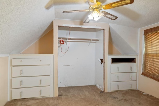 bonus room featuring ceiling fan, a textured ceiling, light carpet, and vaulted ceiling