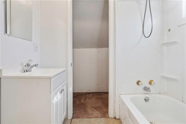 bathroom featuring vanity, tile patterned floors, and shower / bathtub combination