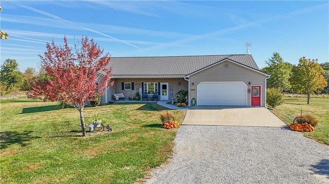 ranch-style house featuring a garage and a front lawn