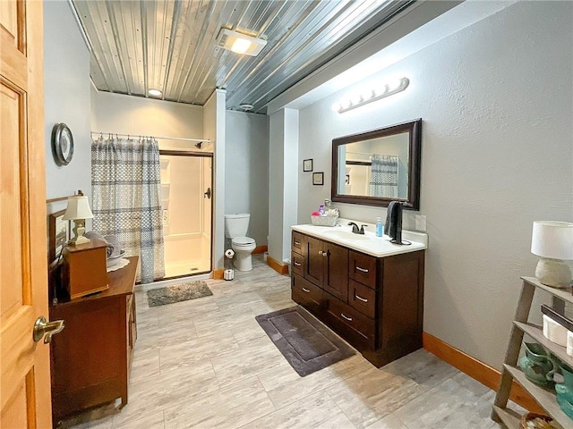 bathroom with vanity, curtained shower, toilet, and wooden ceiling