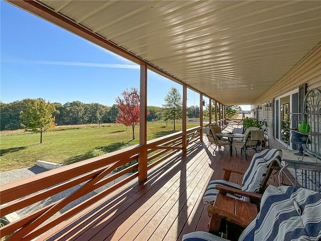 wooden terrace with a yard