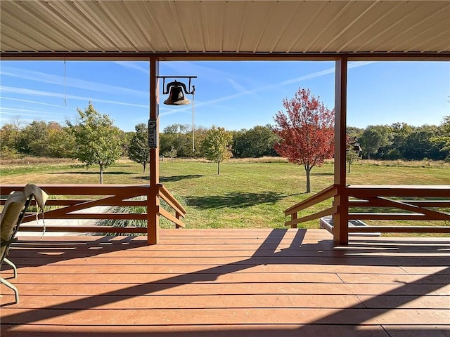 wooden terrace with a yard